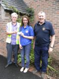 Girl Guide Phoebe Roberts receiving 100 from Honiton Lions